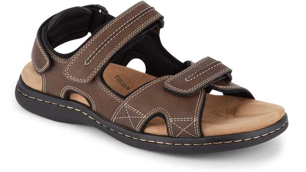 Brown leather walking sandals with adjustable straps, a cushioned insole, and contrast stitching, providing comfort and durability for summer trips to Italy.