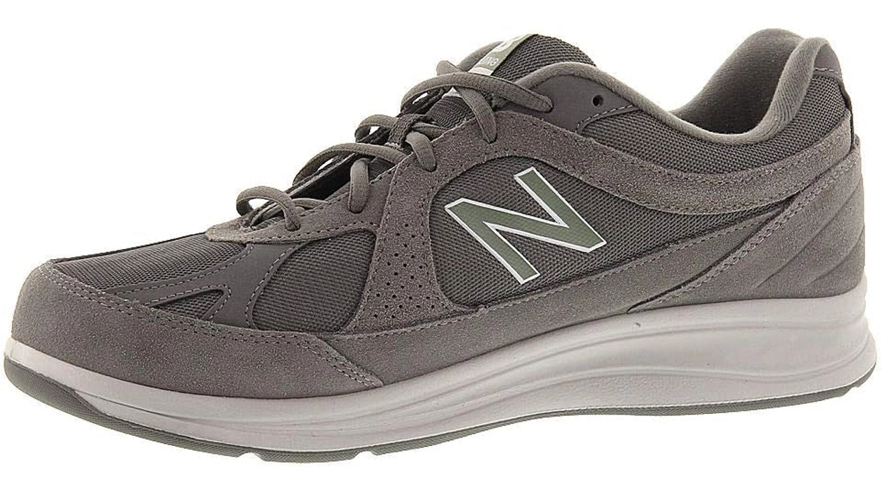 Gray walking sneakers with a cushioned sole, breathable mesh panels, and a classic lace-up design, perfect for sightseeing and city walking in Italy.