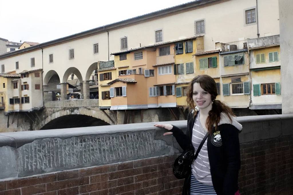 Me at Ponte Vecchio bridge in Florence while solo traveling.